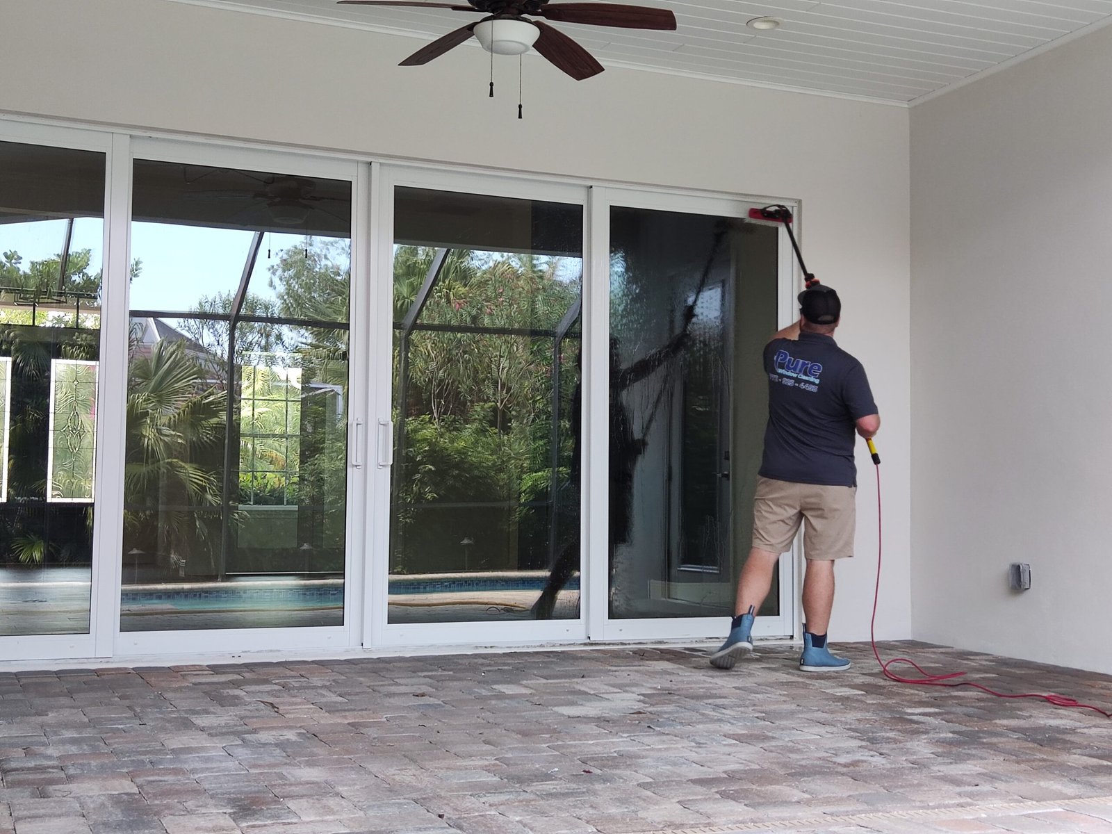 Professional window cleaning on a beachfront luxury home on Hutchinson Island