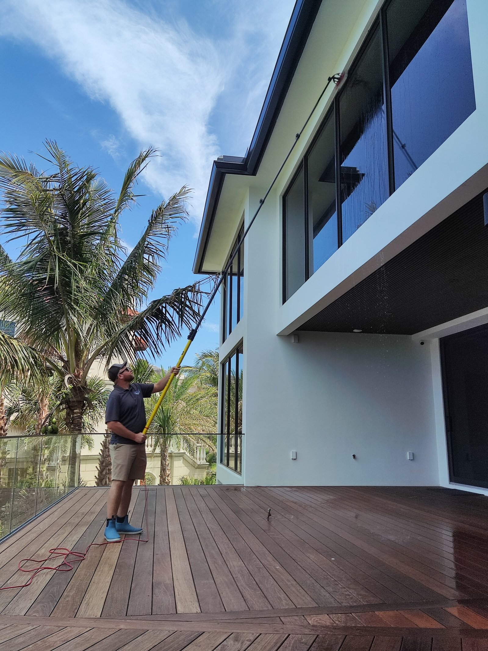 Professional window cleaning at a home in Sebastian FL with crystal clear streak free windows.